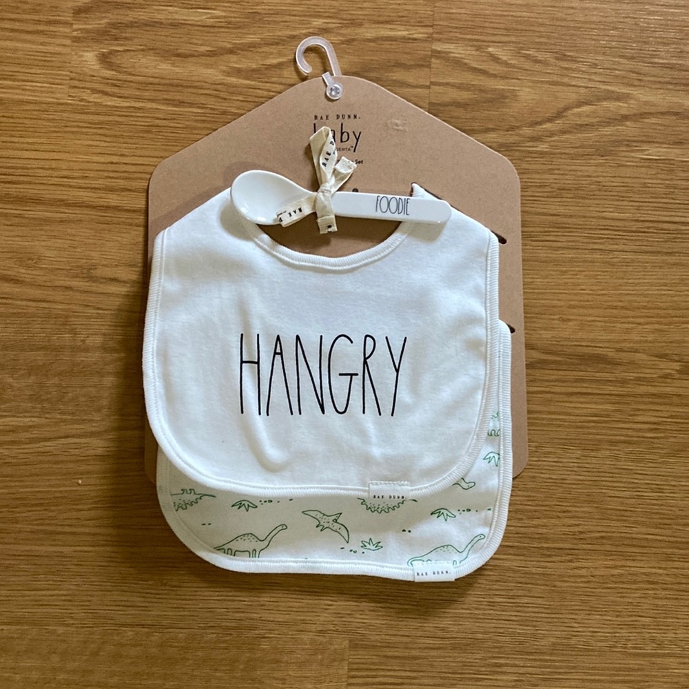 Rae Dunn Bib/Spoon Giftset. Includes two bibs and a feeding spoon. NWT.